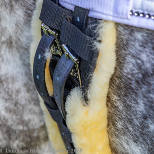 Horze Harleigh dressage girth with lambskin on a dapple gray horse