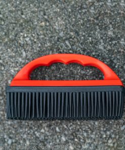 Hair and lint remover rubber brush with red handle